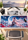 A large desk mat with a detailed anime-style illustration of a white-haired female character in a blue and red fantasy scene, shown on a white desk with a keyboard, mouse, headphones, and monitor.